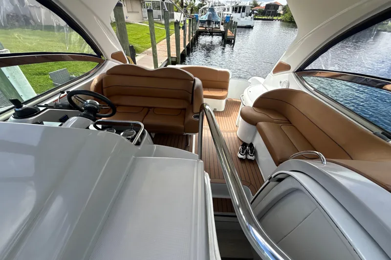  Yacht Photos Pics 2009 Formula 40 Performance Cruiser interior with tan seating and sleek design by the water.
