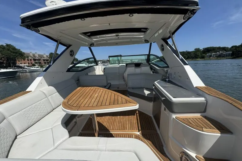  Yacht Photos Pics 2020 Sea Ray Sundancer 320 Outboard interior with elegant seating and wooden accents.