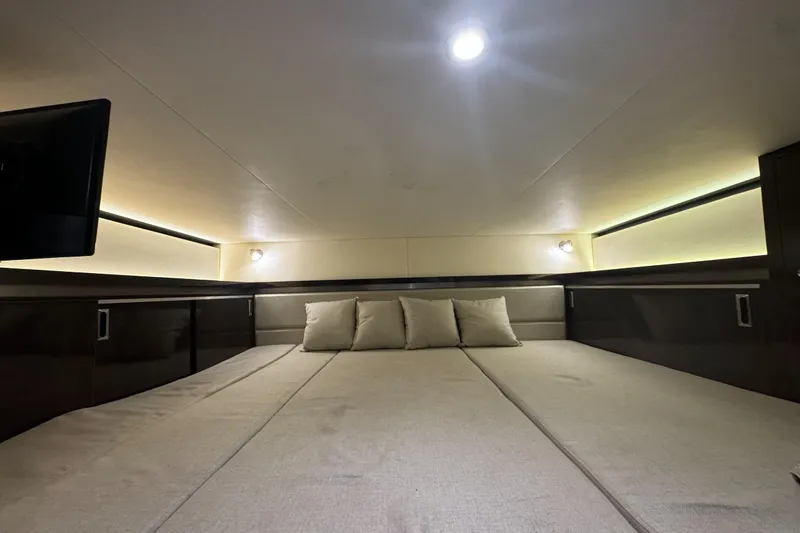  Yacht Photos Pics 2020 Sea Ray Sundancer 320 Outboard cabin interior with cozy bedding and ambient lighting.