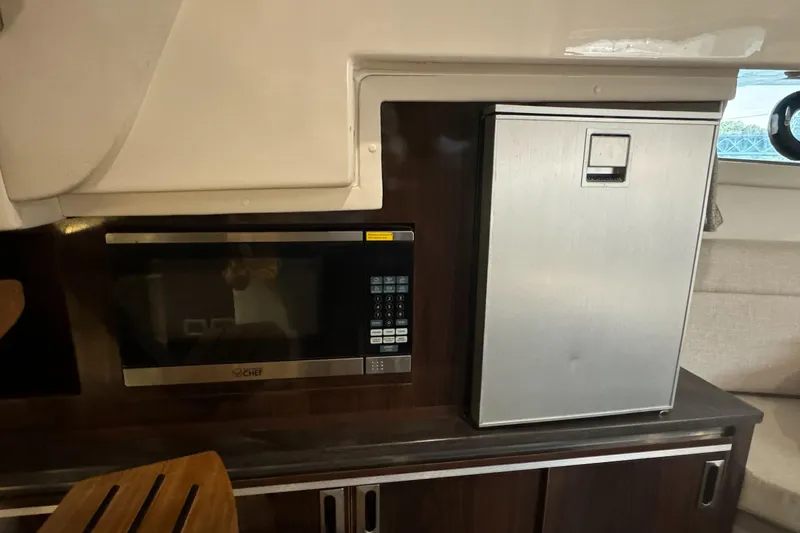  Yacht Photos Pics 2020 Sea Ray Sundancer 320 Outboard interior with microwave and compact fridge.