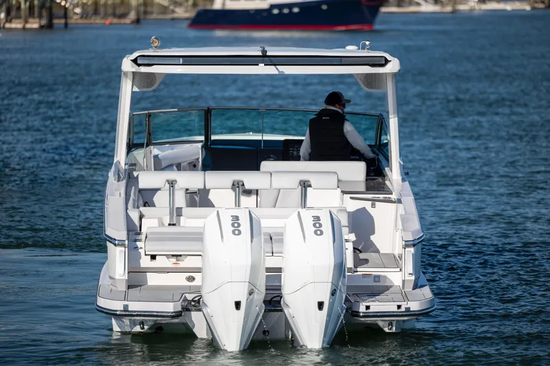  Yacht Photos Pics 2023 Aviara AV32 OB boat with dual outboard engines on water.