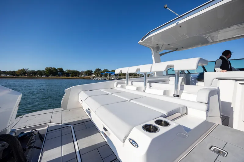  Yacht Photos Pics 2023 Aviara AV32 OB luxury boat with spacious seating and sleek design on a sunny day.