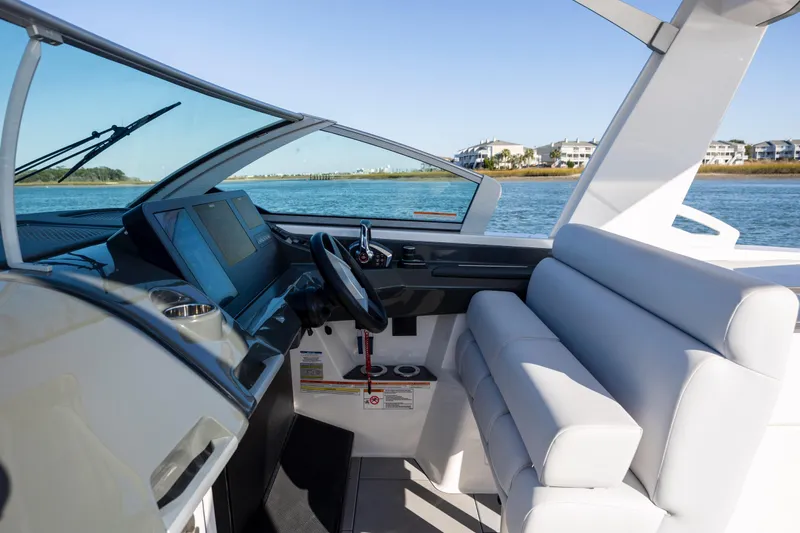  Yacht Photos Pics 2023 Aviara AV32 OB boat interior with modern dashboard and comfortable seating.