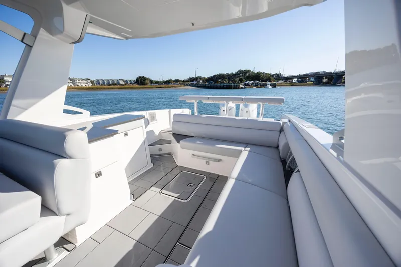  Yacht Photos Pics Luxurious 2023 Aviara AV32 OB boat interior with sleek seating and scenic water view.