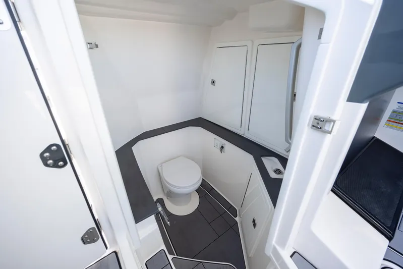  Yacht Photos Pics 2023 Aviara AV32 OB boat interior bathroom with toilet and sink.