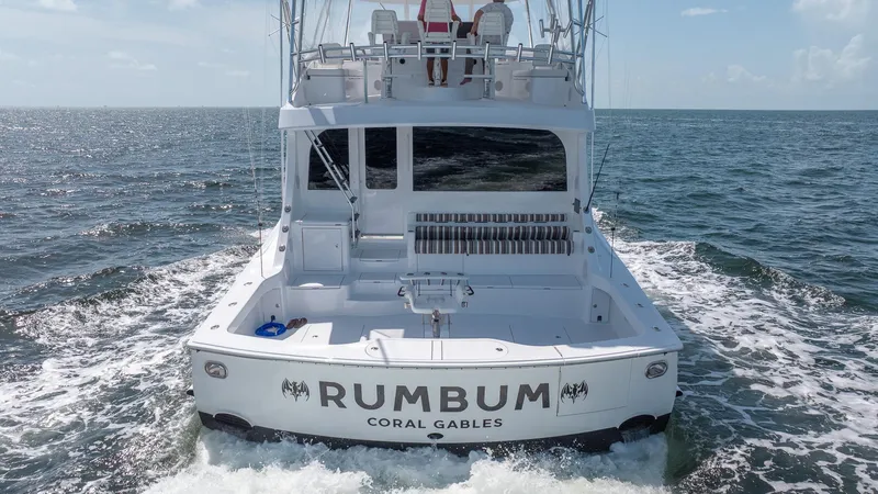  Yacht Photos Pics 2024 Hatteras GT70 yacht "RUMBUM" cruising on open water.