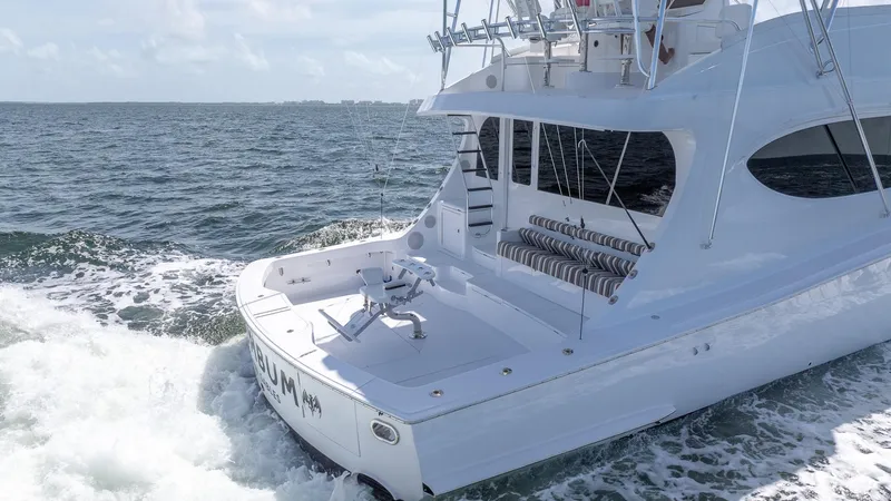  Yacht Photos Pics 2024 Hatteras GT70 yacht cruising on open water.