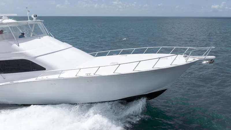  Yacht Photos Pics 2024 Hatteras GT70 yacht cruising on open sea.