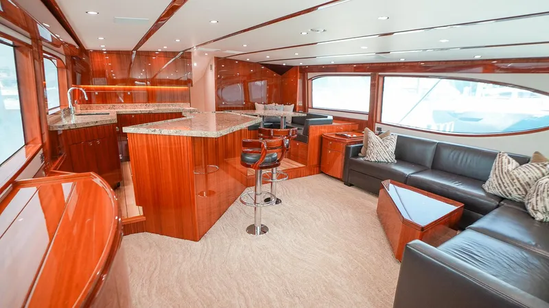 Yacht Photos Pics Luxurious interior of 2024 Hatteras GT70 yacht with elegant wood finishes and modern furnishings.
