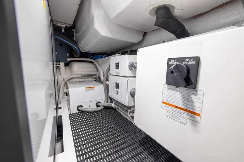  Yacht Photos Pics Engine room of 2024 Hatteras GT70 yacht, featuring electrical components and wiring.