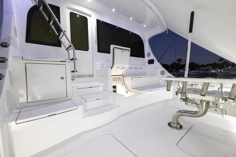  Yacht Photos Pics 2024 Hatteras GT70 yacht deck with sleek white design and modern fixtures.