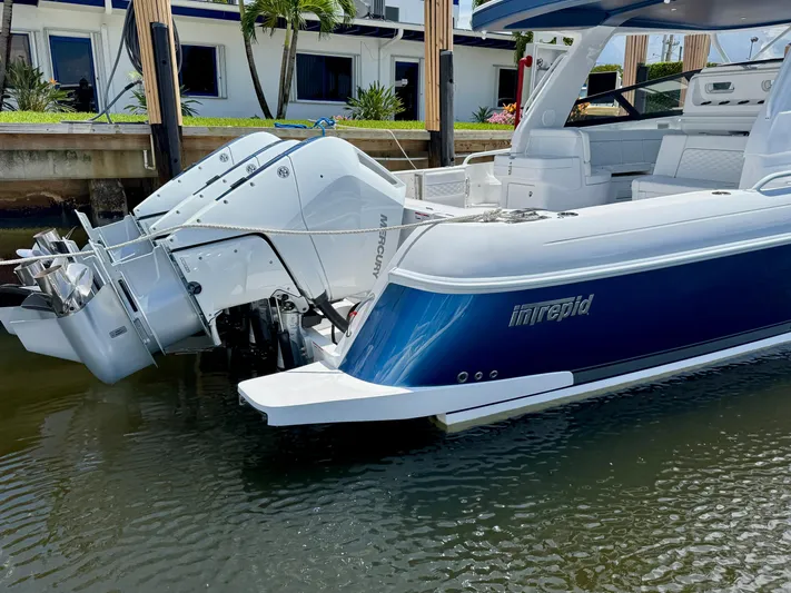  Yacht Photos Pics 2026 Intrepid 438 Evolution boat docked, featuring powerful Mercury outboard engines.