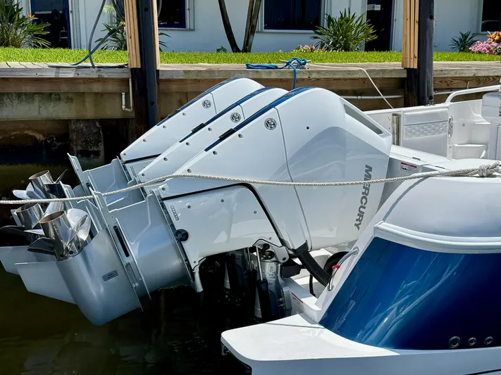  Yacht Photos Pics 2026 Intrepid 438 Evolution boat with powerful Mercury outboard engines docked.