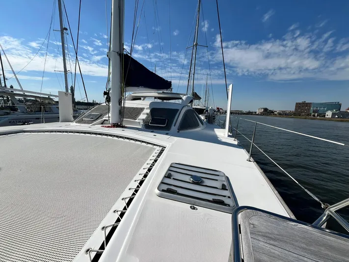 Tao Yacht Photos Pics 2005 Catana 43 Ocean Class catamaran on water, showcasing deck and sails under clear sky.
