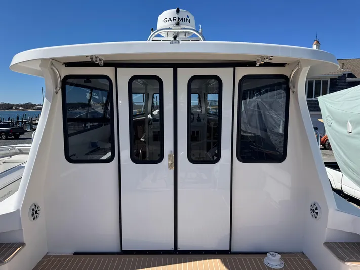 Resolute Yacht Photos Pics Cape Powercat 3500 PH 2020 model with Garmin equipment, docked at a marina.