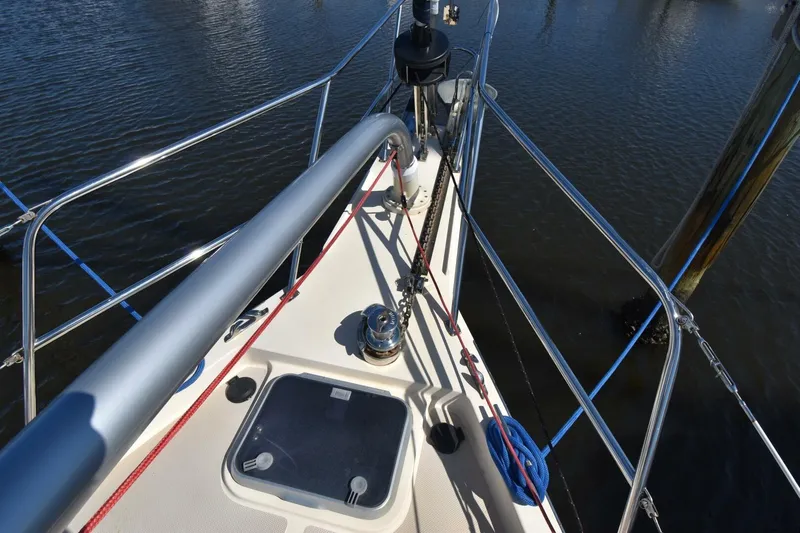 Offline Yacht Photos Pics Bow view of 2019 Island Packet 349 sailboat with deck details and railing.