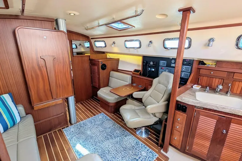Offline Yacht Photos Pics Luxurious interior of 2019 Island Packet 349 yacht with wood finishes and comfortable seating.