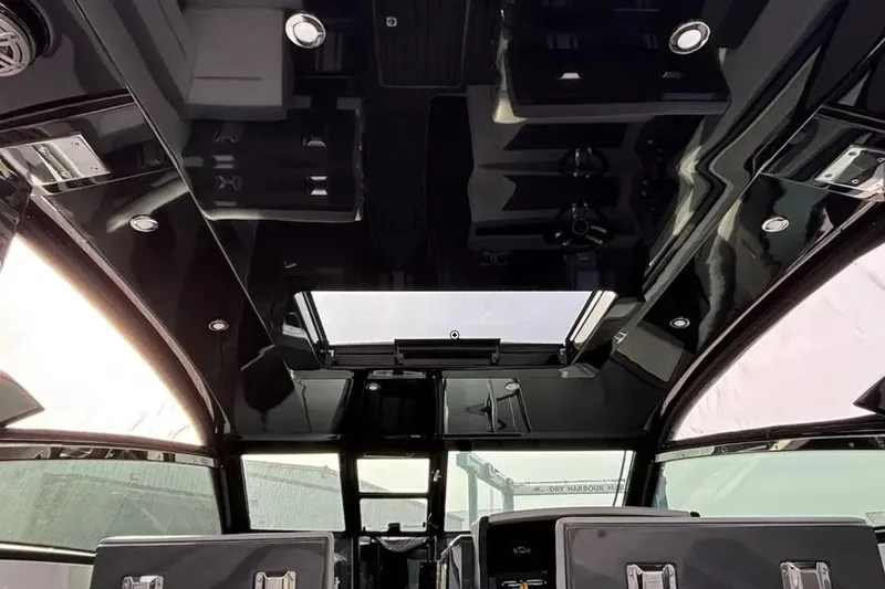  Yacht Photos Pics Interior view of a 2019 Cobalt A36 boat with sleek black ceiling design.
