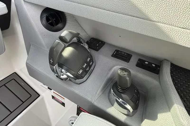  Yacht Photos Pics 2019 Cobalt A36 boat controls with joystick and throttle levers in cockpit.