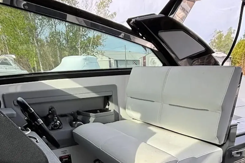  Yacht Photos Pics Interior of a 2019 Cobalt A36 boat with white seating and steering controls.