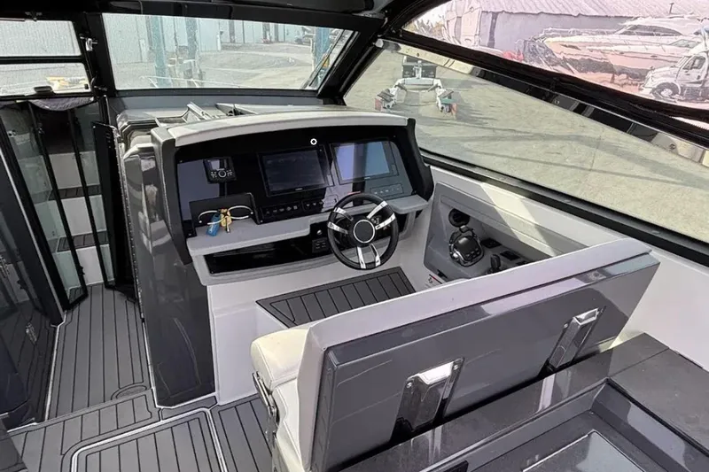  Yacht Photos Pics Interior of a 2019 Cobalt A36 boat, featuring a modern helm and sleek design.