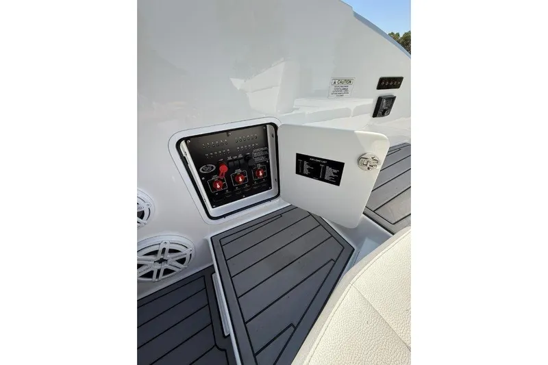  Yacht Photos Pics 2019 Cobalt A36 boat electrical panel with open access door and speakers.