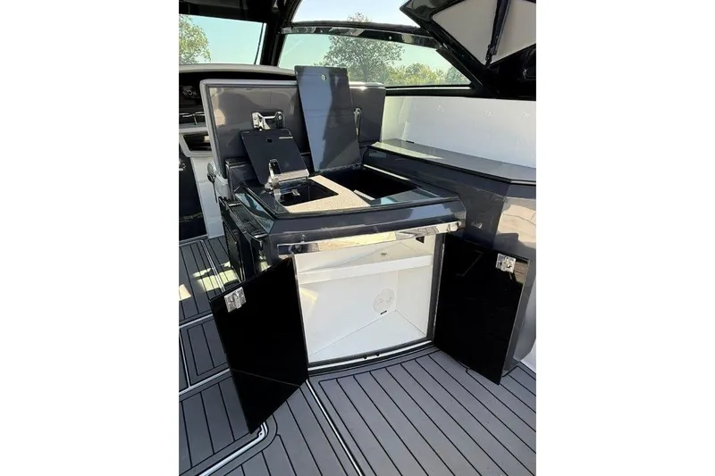  Yacht Photos Pics 2019 Cobalt A36 boat interior with sleek black cabinetry and modern design.