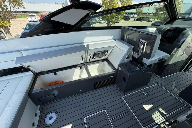  Yacht Photos Pics 2019 Cobalt A36 boat interior with open storage compartments and sleek seating.
