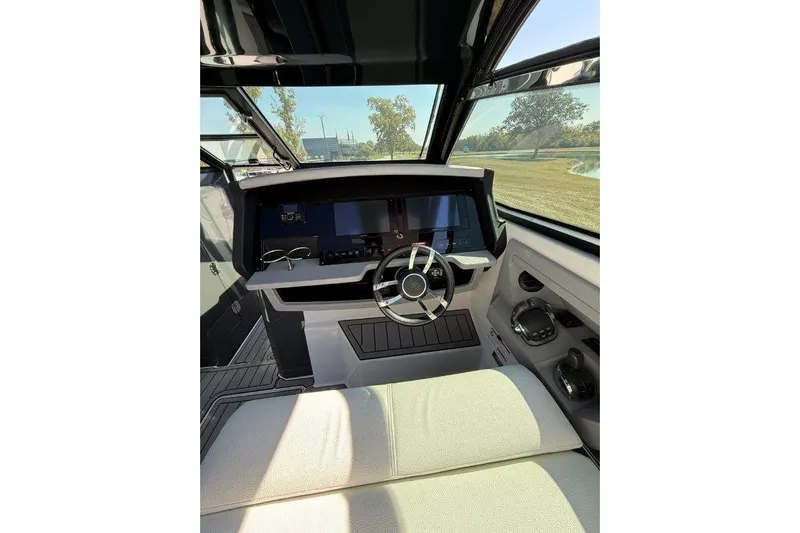  Yacht Photos Pics Interior of 2019 Cobalt A36 boat with modern helm and steering wheel.