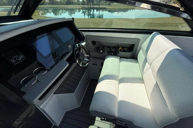  Yacht Photos Pics Interior of a 2019 Cobalt A36 boat with modern dashboard and comfortable seating.