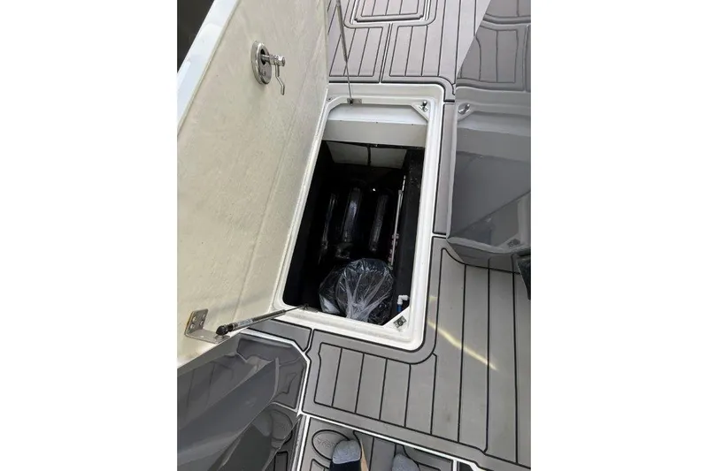  Yacht Photos Pics 2019 Cobalt A36 boat storage compartment with open hatch on deck.