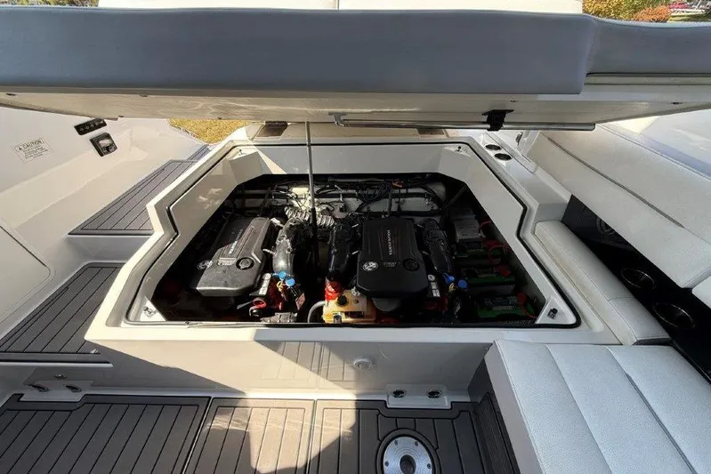  Yacht Photos Pics Open engine compartment of a 2019 Cobalt A36 boat, showcasing detailed engine components.