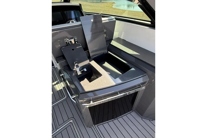  Yacht Photos Pics 2019 Cobalt A36 boat interior with open storage compartment and sleek design.