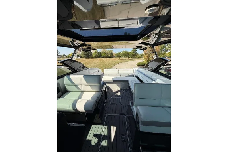  Yacht Photos Pics Interior of a 2019 Cobalt A36 boat with luxurious seating and open sunroof.