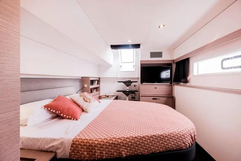  Yacht Photos Pics Luxurious bedroom interior of 2025 Fountaine Pajot Catamaran Aura 51 with modern design.