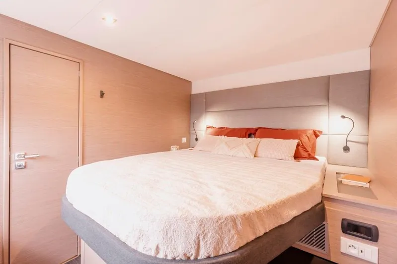  Yacht Photos Pics Luxurious bedroom in 2025 Fountaine Pajot Catamaran Aura 51 with modern decor.