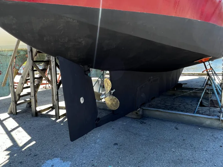 Melodeon Yacht Photos Pics Custom Seakindly Marine Tucker 52 yacht, 2006, on dry dock with visible propeller and rudder.