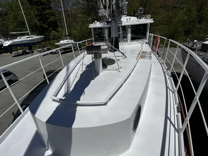Melodeon Yacht Photos Pics Custom Seakindly Marine Tucker 52 boat, 2006 model, docked with visible deck and railing.