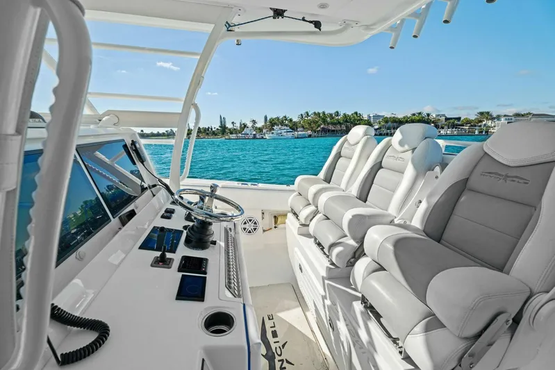 Ohana Yacht Photos Pics 2019 Invincible 42 Open Fisherman boat interior with helm and seating, ocean view.