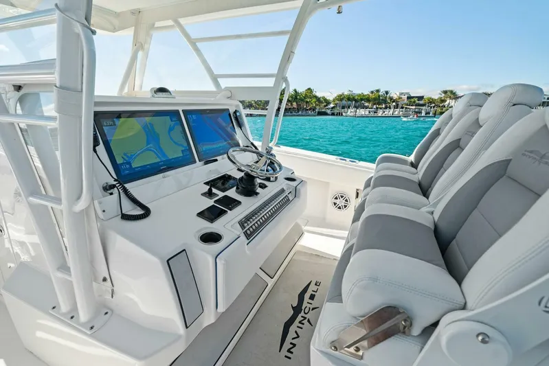 Ohana Yacht Photos Pics 2019 Invincible 42 Open Fisherman boat cockpit with advanced navigation system and comfortable seating.
