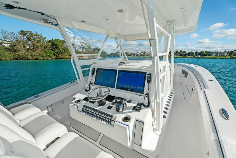 Ohana Yacht Photos Pics 2019 Invincible 42 Open Fisherman boat cockpit with dual screens and steering wheel.