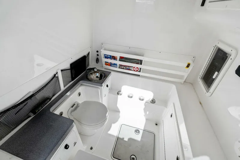 Ohana Yacht Photos Pics 2019 Invincible 42 Open Fisherman boat interior with toilet and storage compartments.