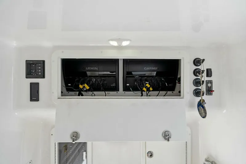 Ohana Yacht Photos Pics 2019 Invincible 42 Open Fisherman electronics compartment with Garmin displays.