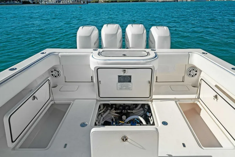 Ohana Yacht Photos Pics 2019 Invincible 42 Open Fisherman boat with open storage compartments and four outboard engines.
