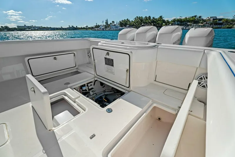 Ohana Yacht Photos Pics 2019 Invincible 42 Open Fisherman boat with open storage compartments and quad outboard engines.