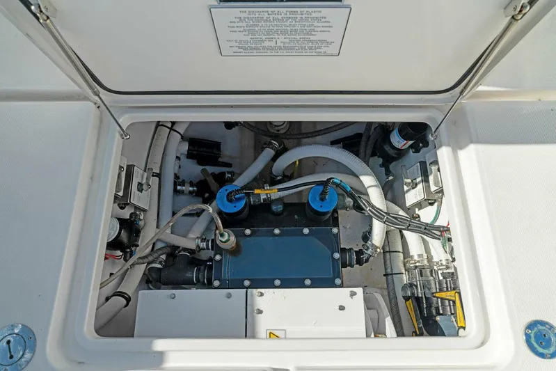Ohana Yacht Photos Pics 2019 Invincible 42 Open Fisherman engine compartment with various mechanical components.