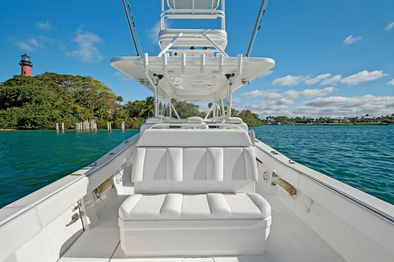 Ohana Yacht Photos Pics 2019 Invincible 42 Open Fisherman boat with white seating on a sunny day.