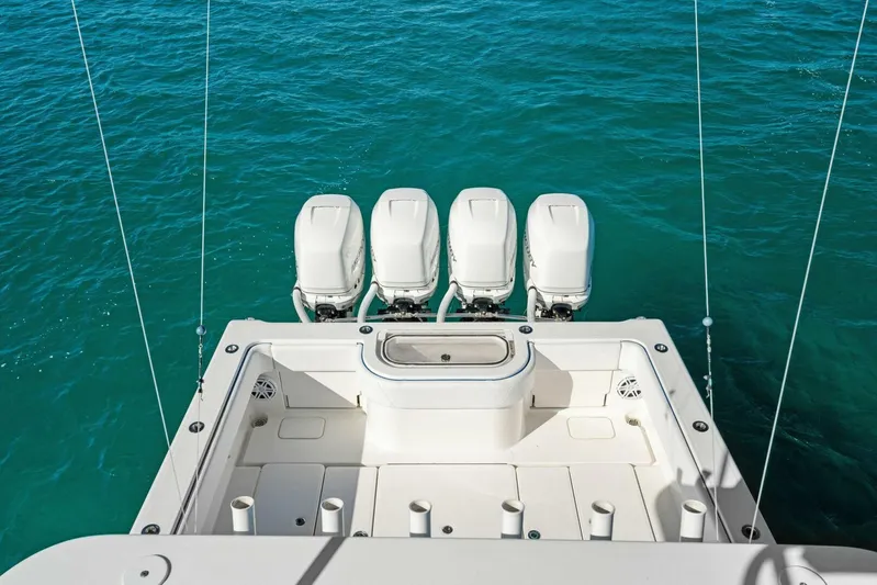 Ohana Yacht Photos Pics 2019 Invincible 42 Open Fisherman boat with four outboard engines on turquoise water.