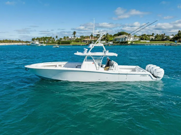 Ohana Yacht Photos Pics 2019 Invincible 42 Open Fisherman boat on clear blue water.