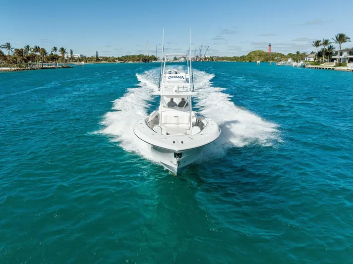 Ohana Yacht Photos Pics 2019 Invincible 42 Open Fisherman boat cruising on clear blue water.